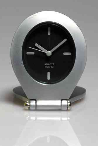Quartz travel clock with alarm and black dial